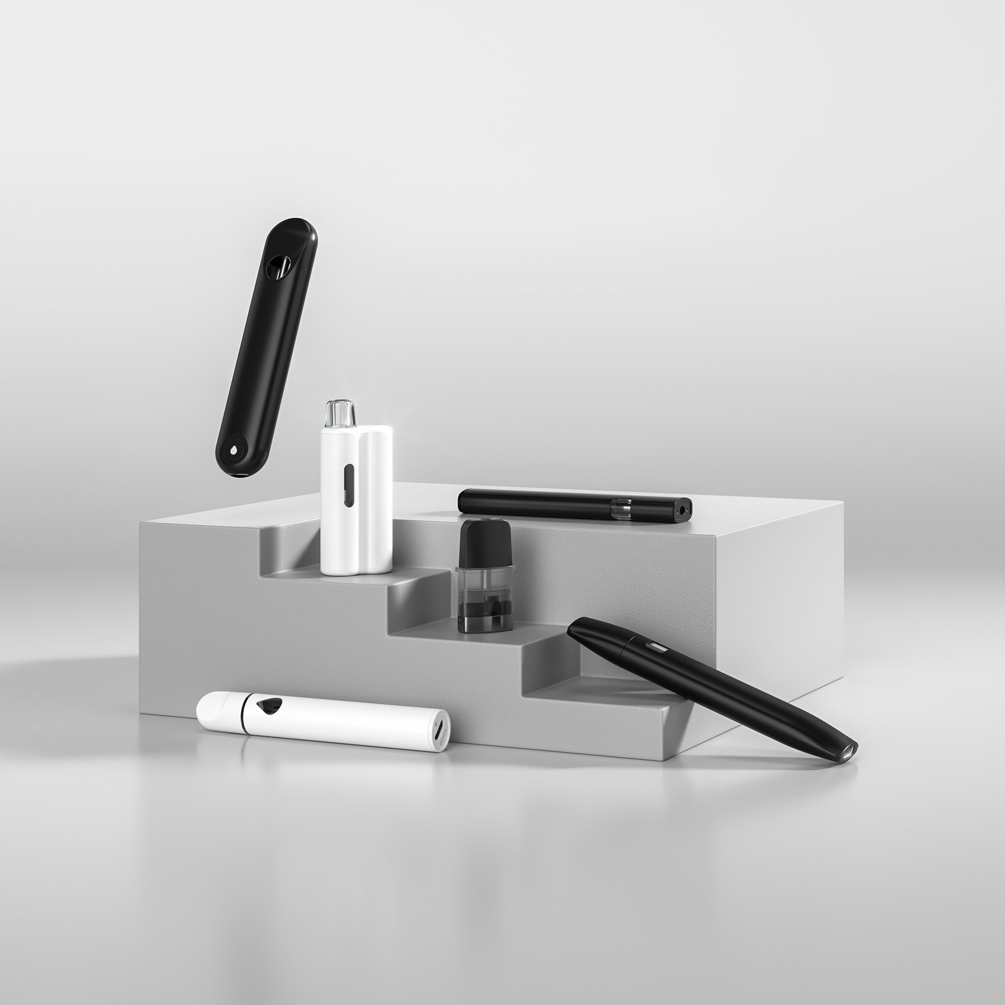 Variety of disposable vape hardware on white pedestal stairs on white background