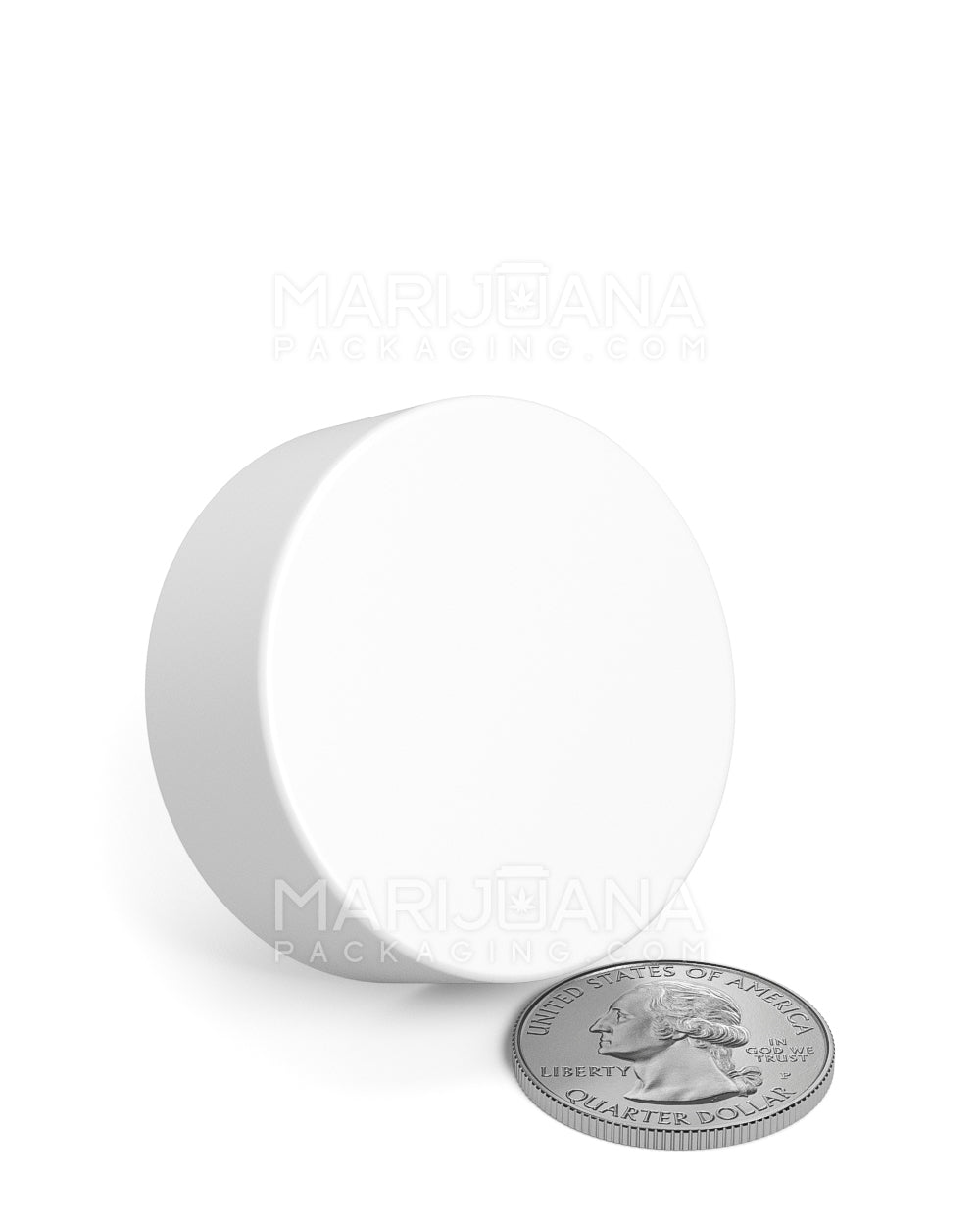 White plastic lid showing side next to a quarter for scale