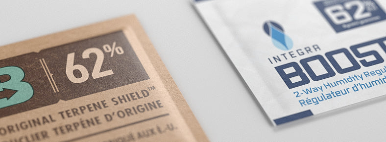 Two humidity packs for marijuana zoomed in on white surface