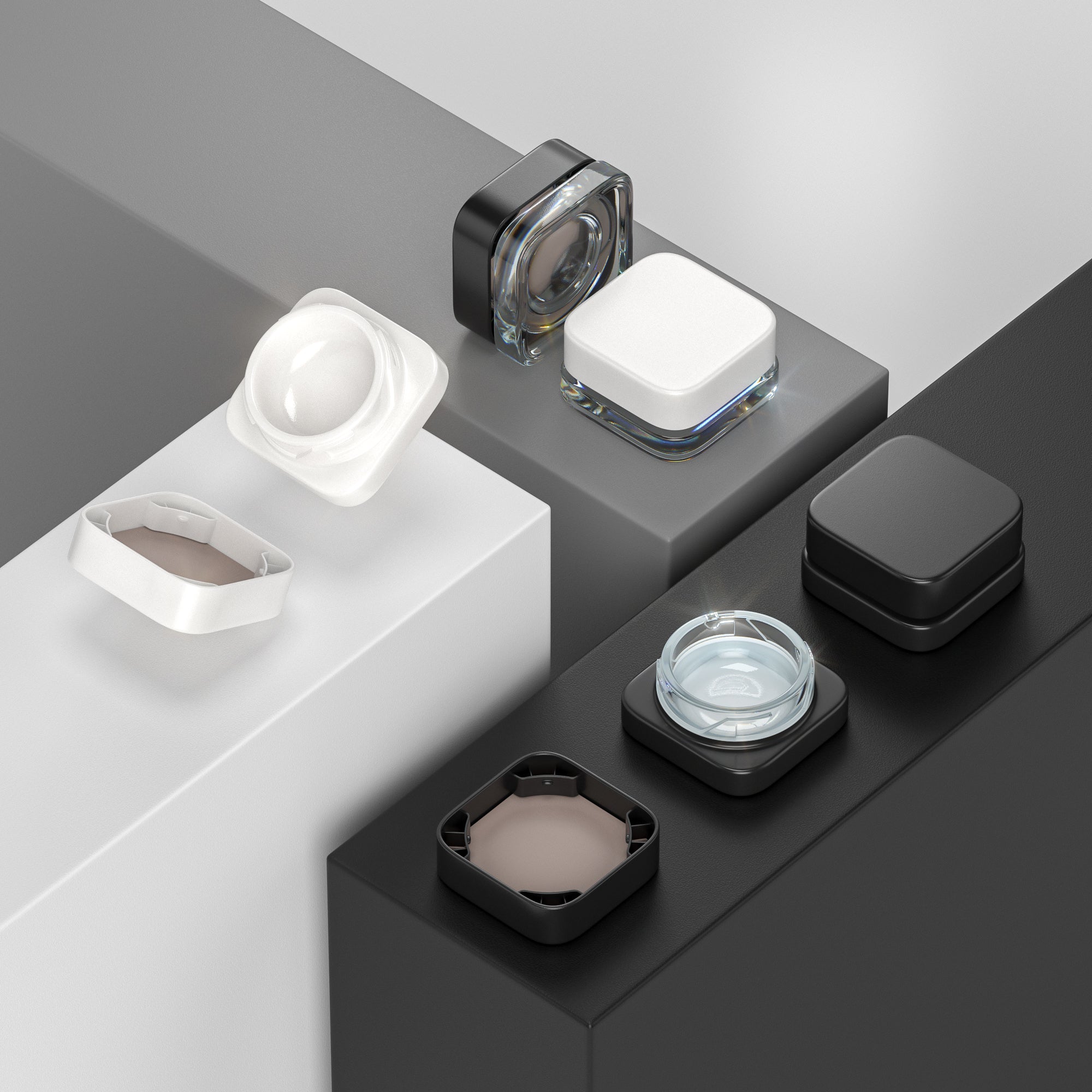 Variety of glass concentrate containers on black and white surfaces