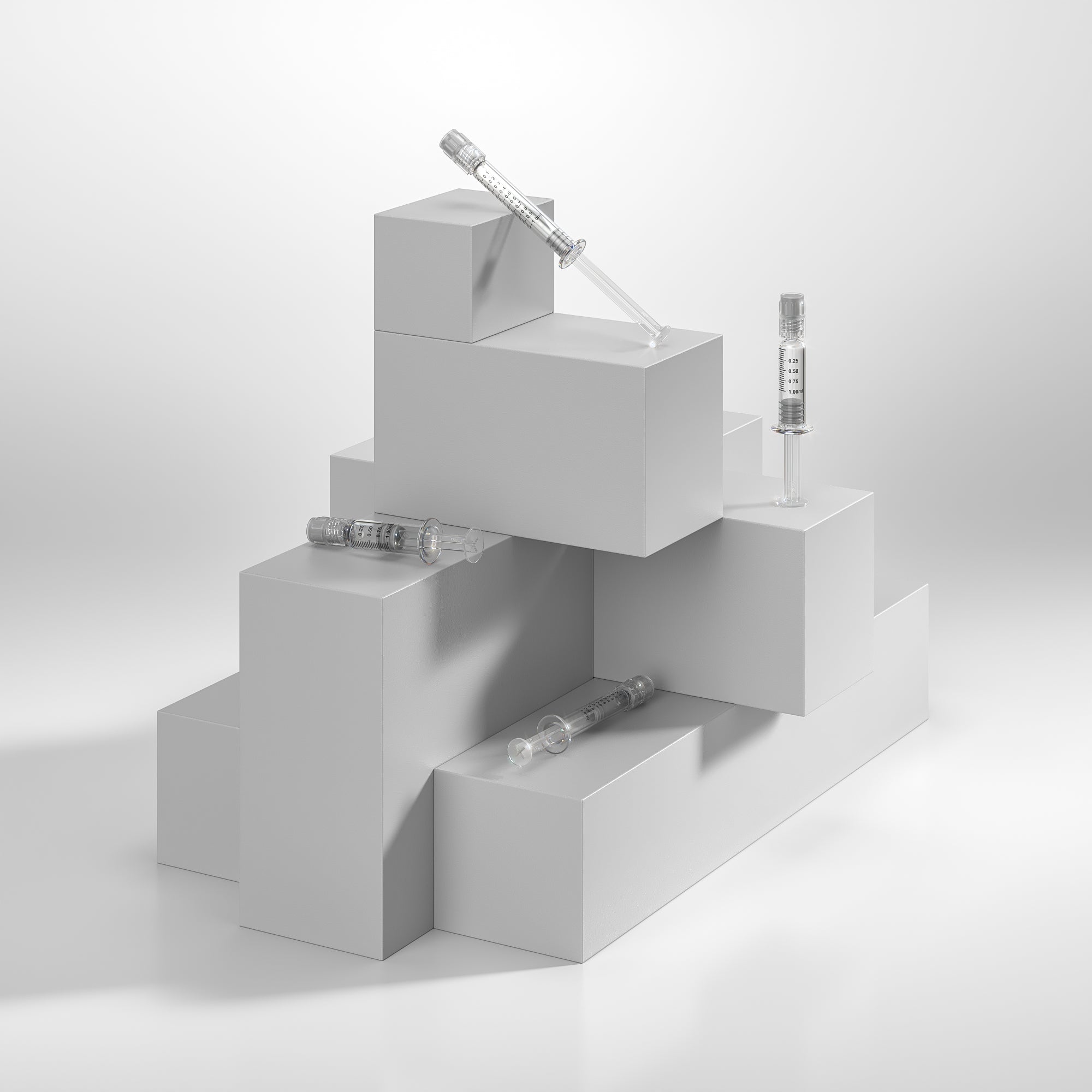 Variety of empty dab syringes on white pedestal stairs on white background