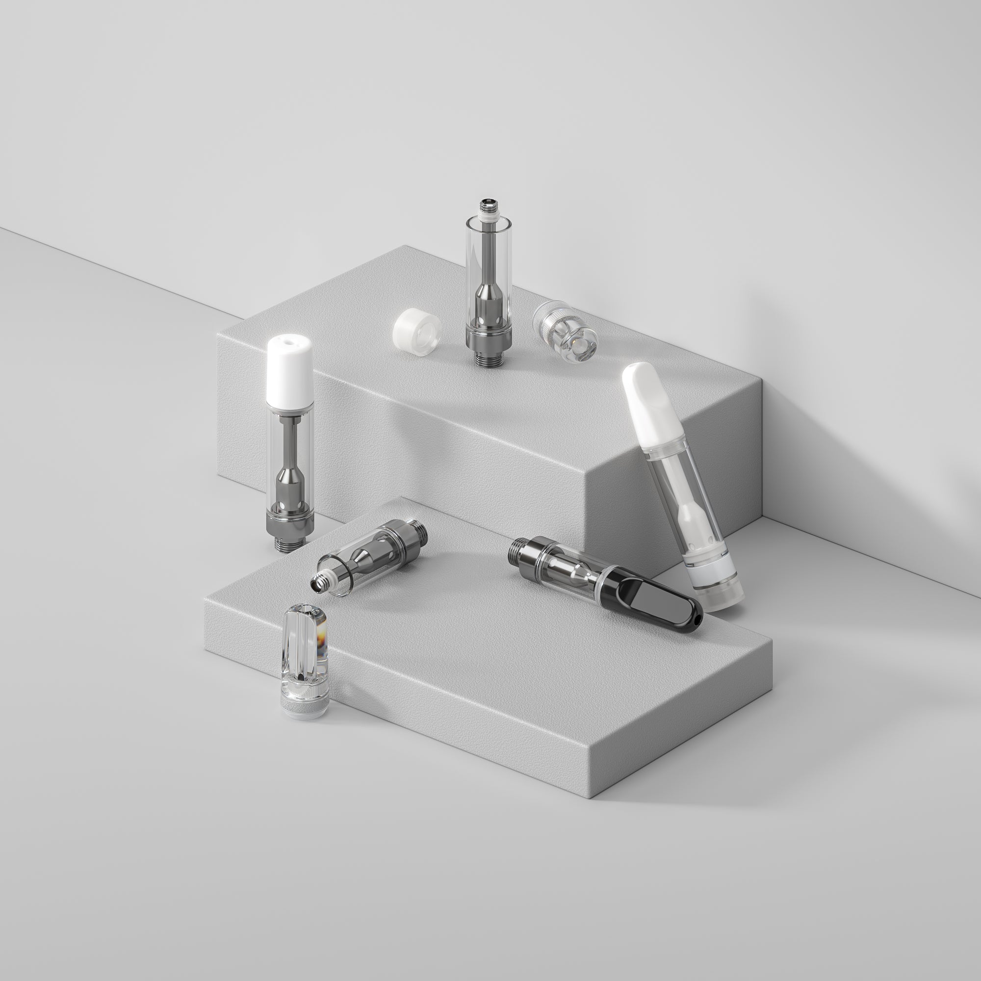 Variety of empty dab cartridges on gray objects