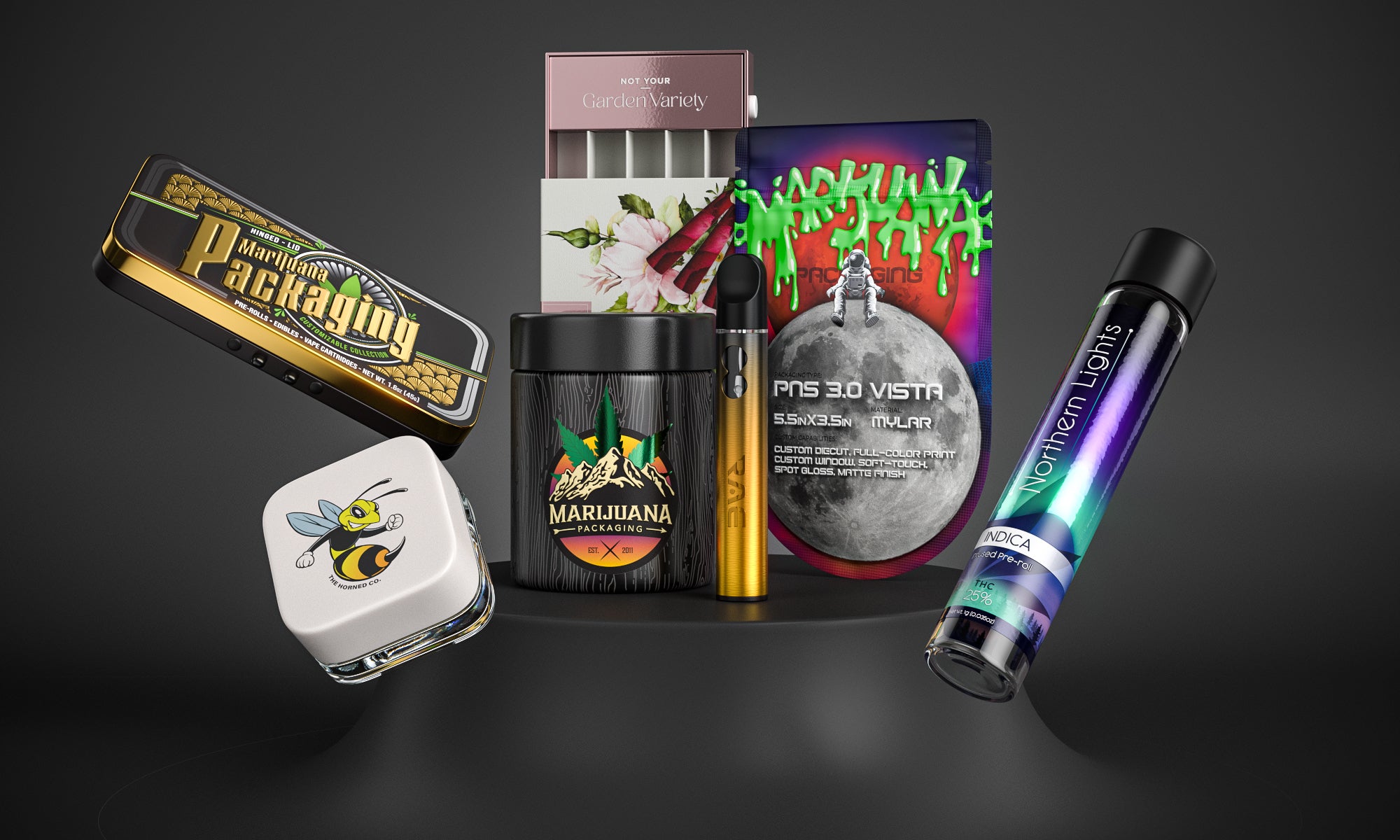 Variety of custom branded cannabis packaging products on pedestal on black background