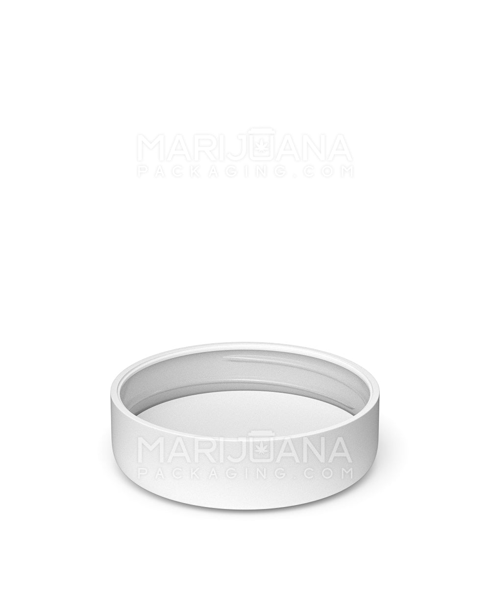 White plastic cap underneath view