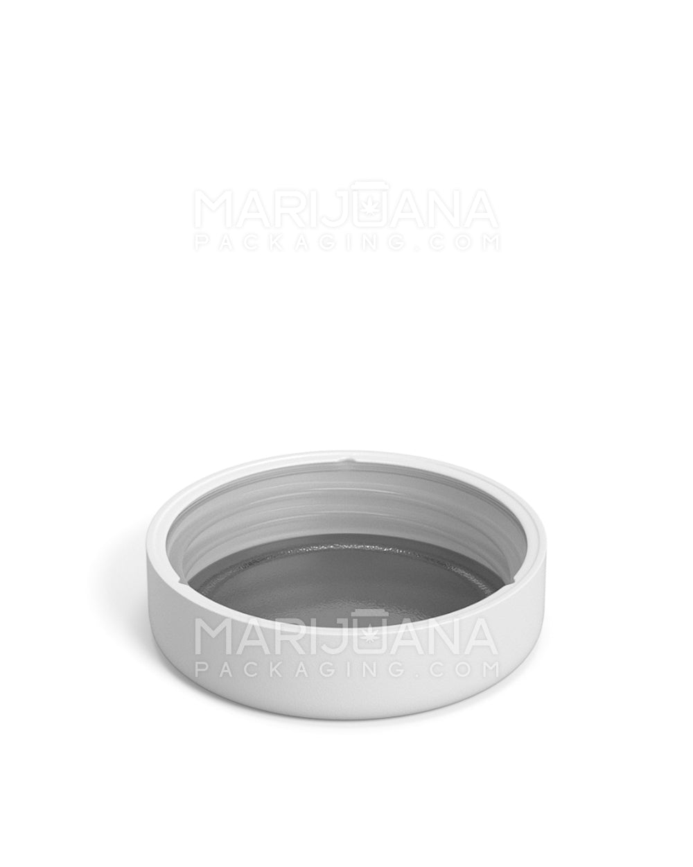 Matte white plastic lid with rounded top - under view showing foil liner